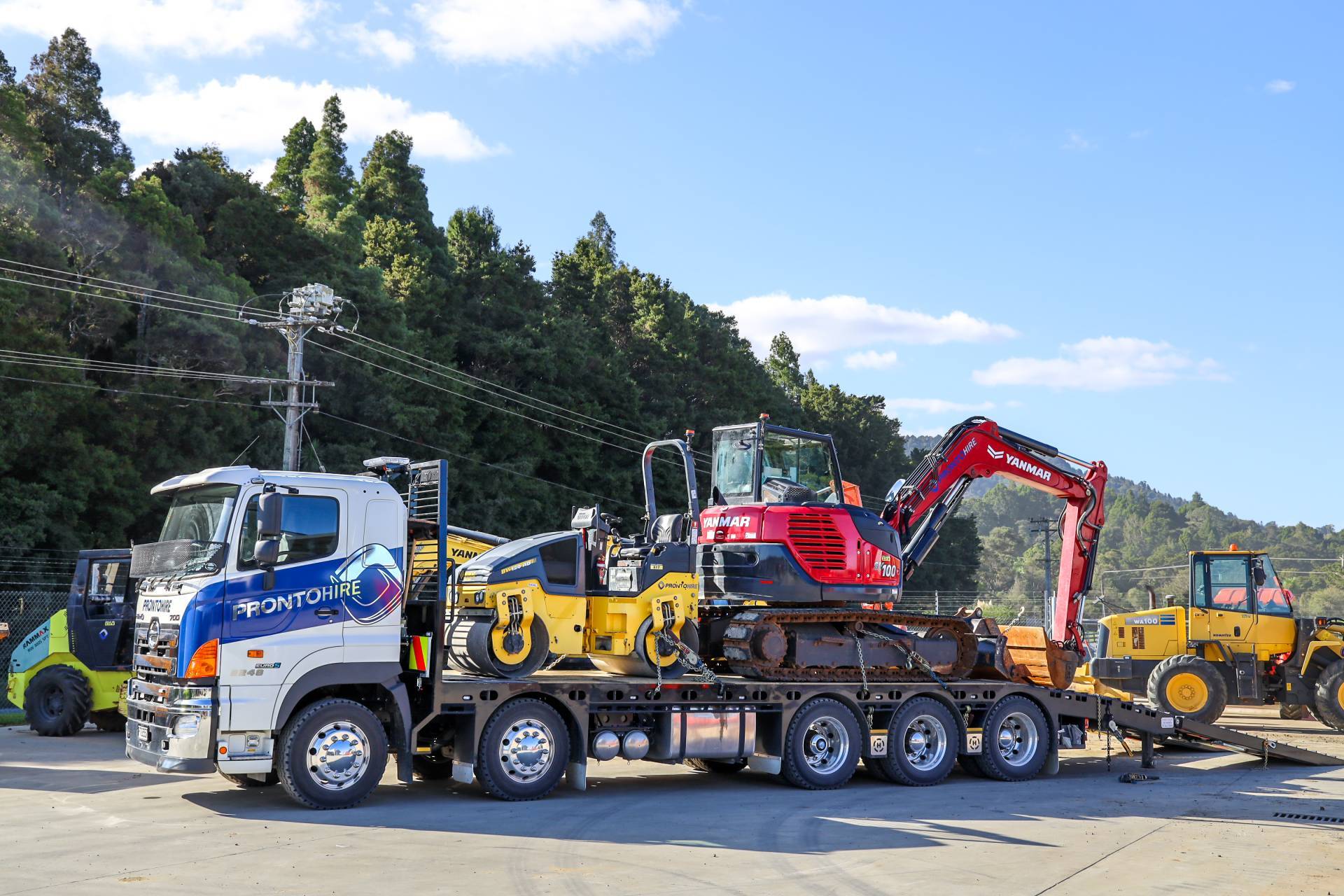 10 Ton Excavator for hire from Pronto Hire Auckland and roller on transport truck